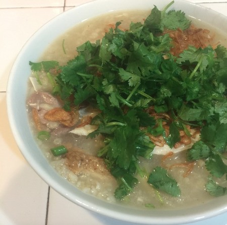 Chicken and Rice Porridge garnished in bowl.