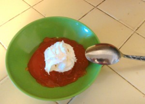 Soda Jello in bowl with whipped topping.