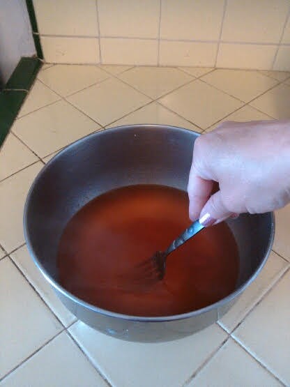 Mixing jello in bowl.