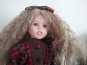 Selling Porcelain Dolls - doll wearing plaid