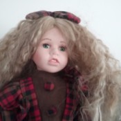Selling Porcelain Dolls - doll wearing plaid