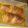Baked sweet bacon chicken on baking sheet