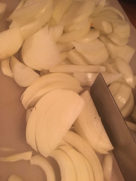 slicing onions for French onion soup.