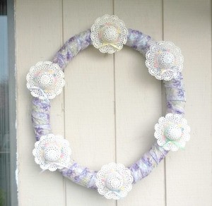 Mini Hat Spring Wreath - finished wreath hanging on porch wall