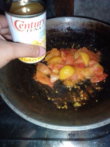 tuna added to cooked tomato