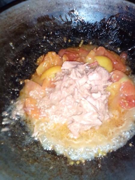 tuna added to cooked tomato