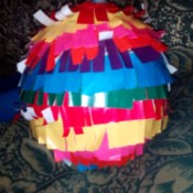 DIY Piñata - balloon wrapped with fringed paper - allow to dry