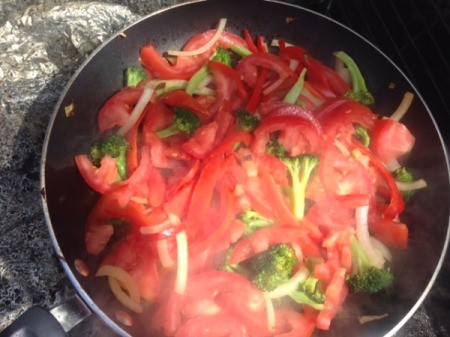 peppers added to cabbage in pan
