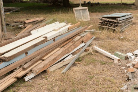 A pile of scrap lumber at a construction site.