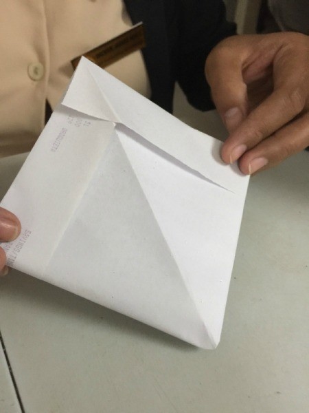 Folded Paper Box - open the triangle and fold opposite sides together