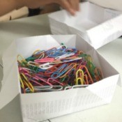 Folded Paper Box - box filled with colored paper clips
