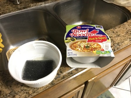 A noodle bowl being reused as a soap dish.