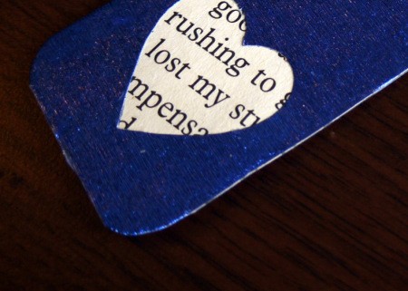 Punched Paper Bookmark - closeup of text through heart cutout