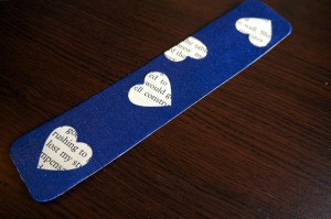 Punched Paper Bookmark - dark blue paper bookmark with heart cut outs