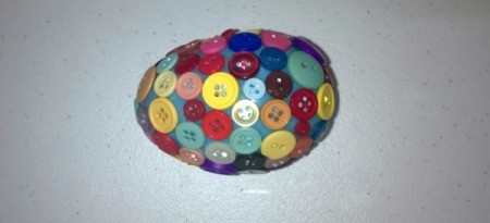 Unique Eggs in One Homemade Basket - egg with varying sized buttons glued on