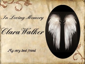 A card in memory of Clara Walker with angel wings.