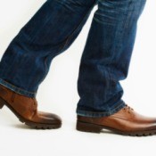Close up of men's leather shoes walking.