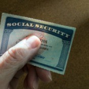 Hand holding Social Security Card.