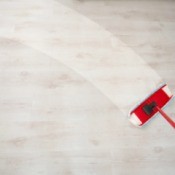 Mop cleaning a wooden floor.