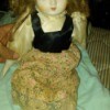Doll Maker and Value  - doll with flowered dress, black bodice, and ivory blouse