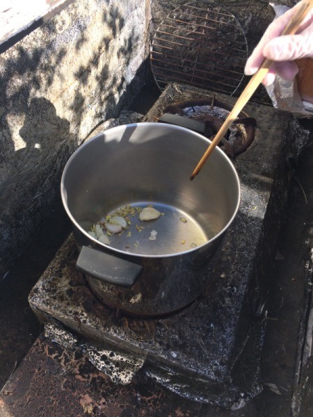 pan on stove with oil and garlic