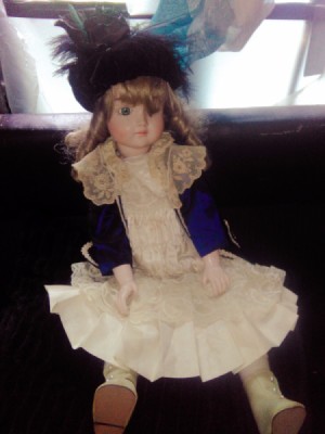 Value of Porcelain Doll - doll wearing a lacy dress