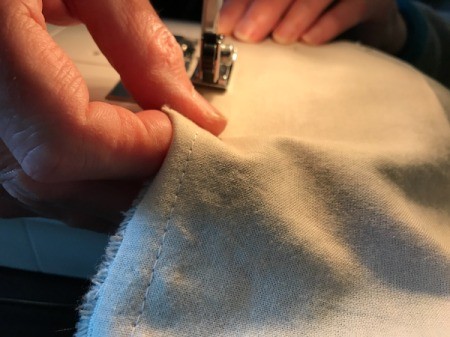 Fabric Cover for Baby Gate - sew a 1/4 inch seam around the panels leaving an opening to turn