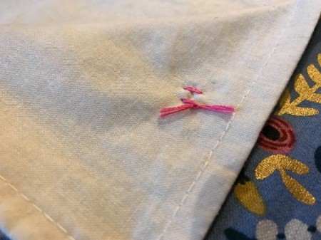 Fabric Cover for Baby Gate - tied floss securing button