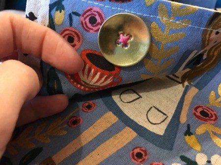 Fabric Cover for Baby Gate - view of sewn button