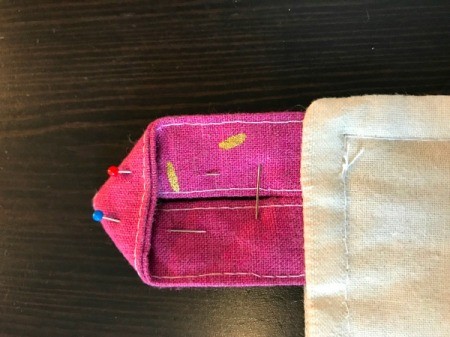 Fabric Cover for Baby Gate - pinning folded end of button loop