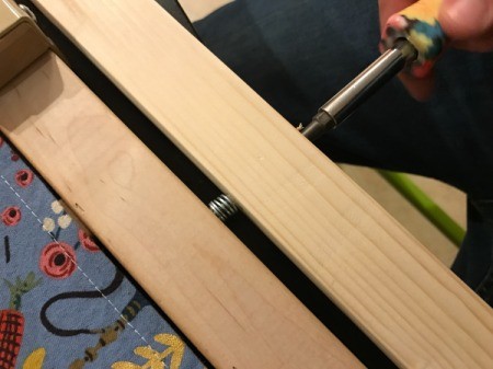 Fabric Cover for Baby Gate - screwing wood strips to bottom of gate