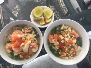 Vietnamese Shrimp, Pork and Egg Noodle Soup (Bun Rieu) in bowls