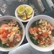 Vietnamese Shrimp, Pork and Egg Noodle Soup (Bun Rieu) in bowls