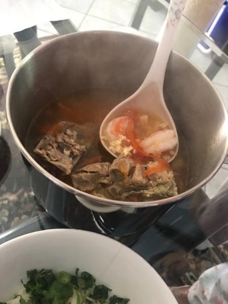 soup added to noodles and veggies