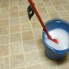 Mop and bucket on linoleum floor
