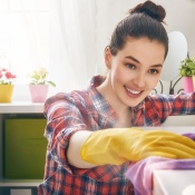 Woman Spring Cleaning in her home