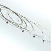 Unstrung Guitar strings on white background