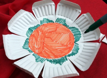 Paper Plate Flower - orange center with green scallops around center