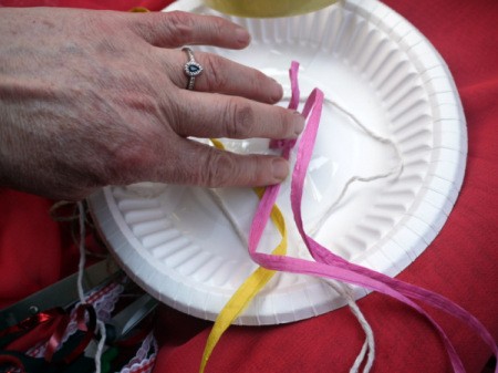 Fun Paper Plate Jelly Fish Decoration - taping varying lengths of ribbon and cord to underside for tentacles