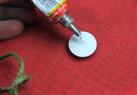 Fun Paper Plate Jelly Fish Decoration - putting a dot of glue on the back of a wiggly eye