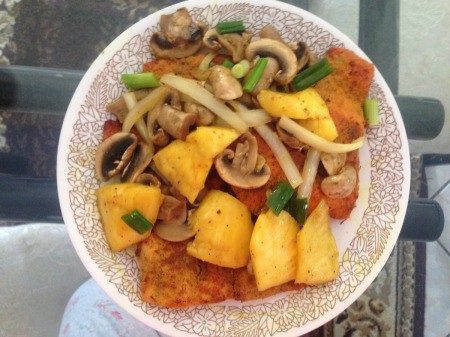 Salmon Topped with Pineapple and Mushrooms on plate