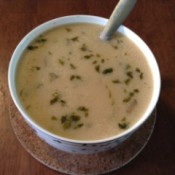 A bowl of creamy Tom Kha Gai soup.