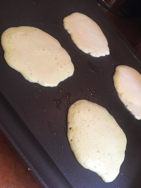 crepe batter on hot cooking surface