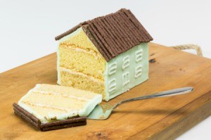 House shaped cake with the end slice off.