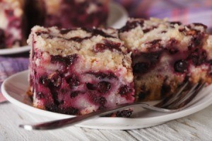 Slice of Blackberry Buckle on a plate.