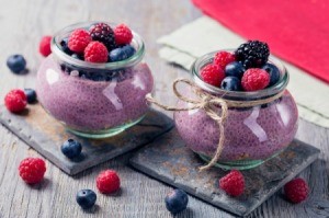 Blackberry Pudding topped with berries.