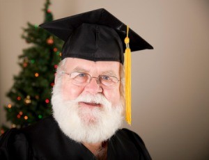 Santa wearing a graduation cap.