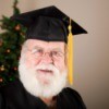 Santa wearing a graduation cap.