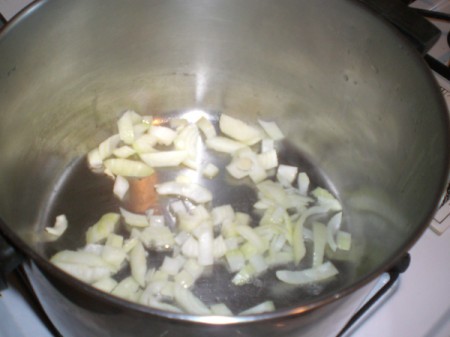 garlic and onion in pan for carrot ginger soup.