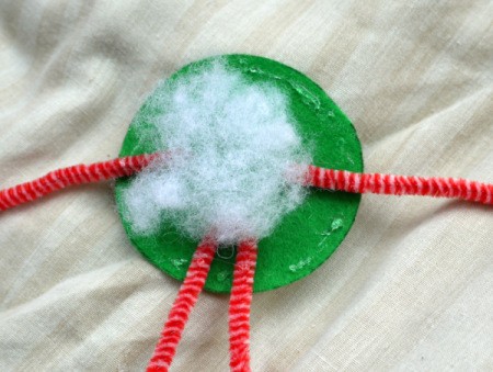 One Eyed Monster Badge - apply glue around the outside edge of felt circle and add a small amount of stuffing to center